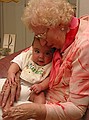 Great Grandma Fern and Griffin share a hug.